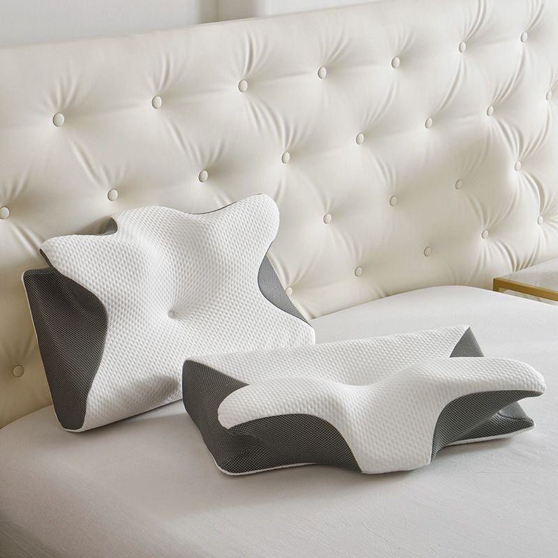Butterfly-shaped memory foam pillow set (2 pieces) in black and white, shown from above.