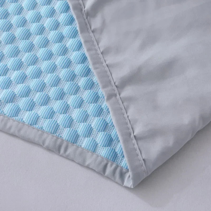 Close-up of a flat-laid corner of the pillow cover, showing the quilted texture and edge stitching.